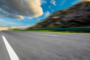 Motion blurred road and mountains at sunrise.mountain road background.