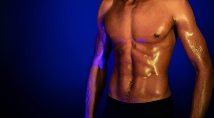 Muscular Man With Perfect Abs Posing On Blue Background, Cropped