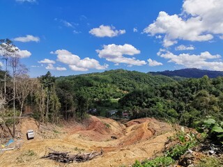 Beautiful green forest and blue sky above during a trekking in Tambunan, Sabah. Malaysia, Borneo....