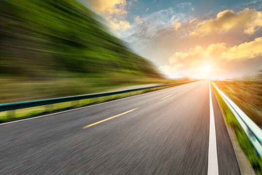 Motion blurred road and mountains at sunrise.mountain road background.