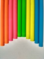 colorful pencils unsharpened formed in semi circled form
