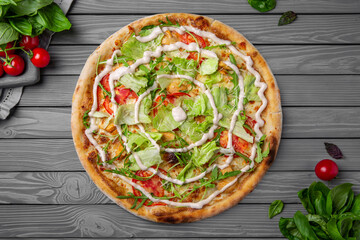 Tasty hot italian light diet pizza with iceberg salad, tomatoes and sauce. Pizzeria menu. Concept poster for Restaurants or pizzerias. Top view