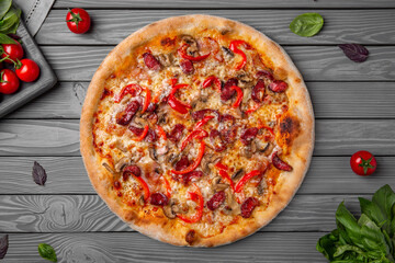 Tasty hot italian pizza with hunting sausages, bacon, pepper and mushrooms. Pizzeria menu. Concept poster for Restaurants or pizzerias. Top view
