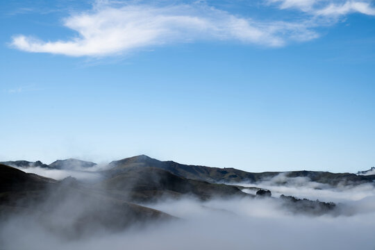 Silhouette of mountains in the misty morning. View of the mountains in early winter. Beautiful nature landscape. Bank Peninsula, Robinsons bay, Canterbury, Ndw Zealand.