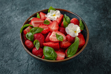 Diet vegetarian salad with strawberries and basil.