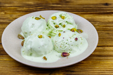 Pistachio ice cream on wooden table