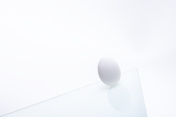 fresh white chicken eggs on glass isolated on white background