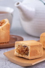 Pineapple cake pastry - Taiwanese famous sweet delicious dessert food with tea, close up, copy space design.