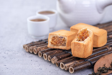 Pineapple cake pastry - Taiwanese famous sweet delicious dessert food with tea, close up, copy space design.