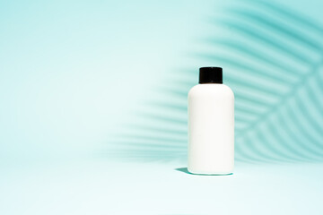 White container without labels on clean blue background,