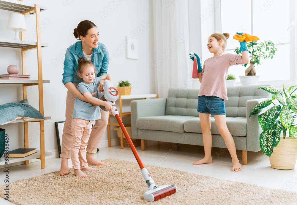 Wall mural family cleaning the room