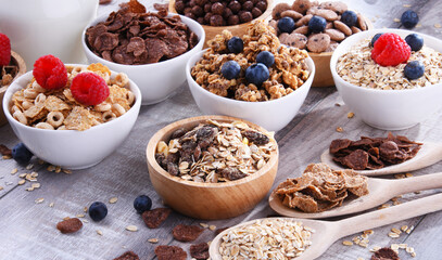 Bowls with different sorts of breakfast cereal products