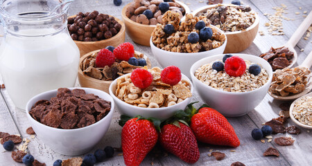 Bowls with different sorts of breakfast cereal products