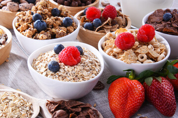 Bowls with different sorts of breakfast cereal products