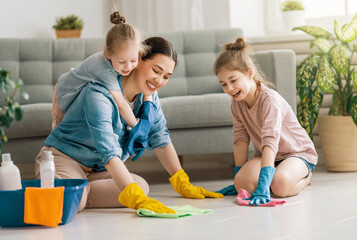 family cleaning the room