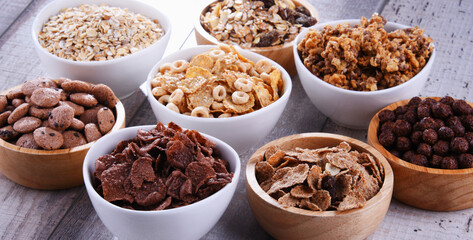 Bowls with different sorts of breakfast cereal products