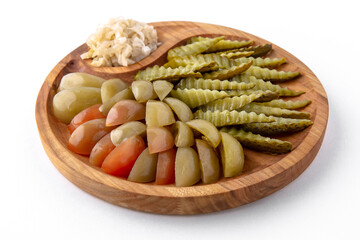 Pickles in a wooden plate. Banquet festive dishes. Gourmet restaurant menu. White background.