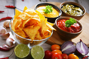 Composition with bowl of potato chips.