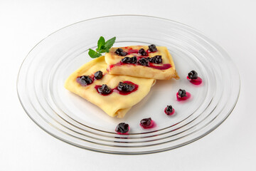 Topped pancakes. Banquet festive dishes. Gourmet restaurant menu. White background.