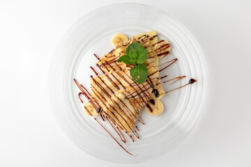 Topped pancakes. Banquet festive dishes. Gourmet restaurant menu. White background.