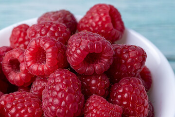 Raspberries close-up. Macro image of fresh raspberries
