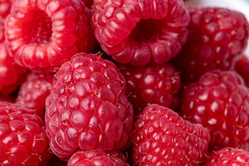 Raspberries close-up. Macro image of fresh raspberries