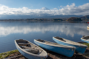 Boats parked on the shore of lake Kawaguchiko, Japan, near Mount Fuji. 