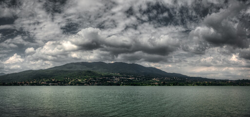 Cloudy sky over the lake of Varese in spring afternoon