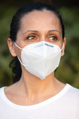 Brunette adult woman with a mask