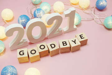 Goodbye 2021 alphabet letters with space copy on pink background