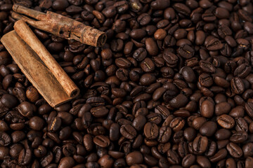 cinnamon sticks on coffee beans, coffee background