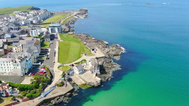 Aerial view on sandy Beach and coast of Atlantic Ocean in Portrush Northern Ireland, Top view on small coastal town 