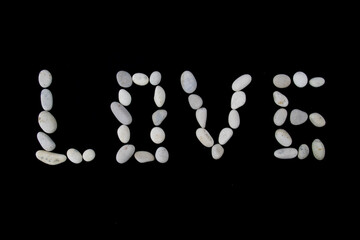 Love text on black color background with copy space using with stones