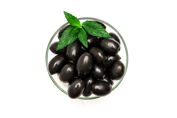 Black olives with mint leaves on a white background