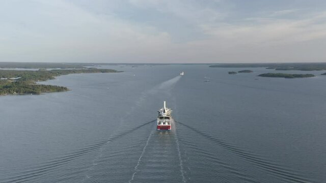 Drone aerial view of LNG powered ropax ferry ship with rotor sail and LNG tanks.
