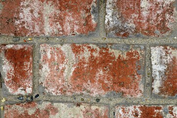 Background wall made of orange aged bricks close up