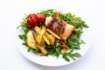 Chicken breasts filled with creamy parmigiana stuffing and wrapped in prosciutto