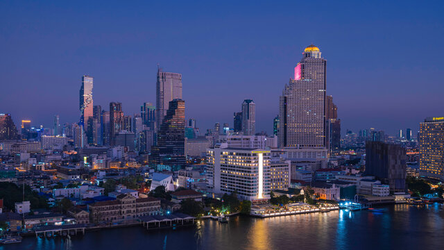 Fototapeta Aerial and panorama view of Bangkok skyscraper cityscape and river in twilight blue hour