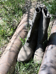 a pair of old leather cobweb boots