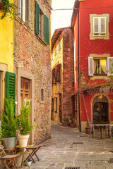 Fototapeta na wymiar Street with historic houses in Montecatini Alto - medieval village above Montecatini Terme town in Tuscany, Italy, Europe.