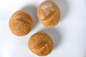 freshly delicious baked bun breads that on top with grain isolated on white background. top view