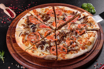 Fresh hot pizza with meat, mushrooms, cheese and tomatoes made in an oven