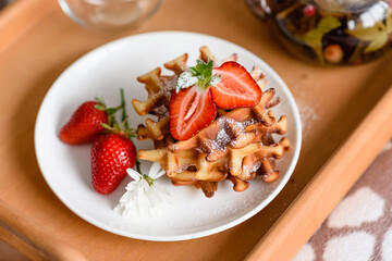 Delicious fresh baked belgian waffles with berries and fruit