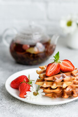 Delicious fresh baked belgian waffles with berries and fruit
