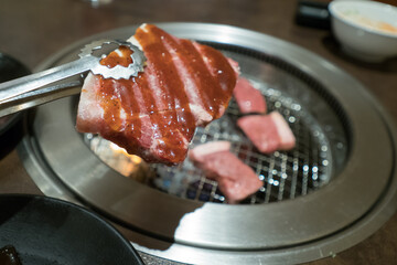 A delicious looking steak cooking on the grill