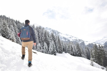 Fototapeta na wymiar A man in the snowed mountains
