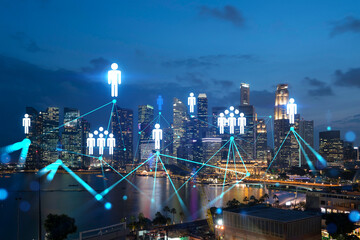 Plakat Glowing Social media icons on night panoramic city view of Singapore, Asia. The concept of networking and establishing new connections between people and businesses. Double exposure.