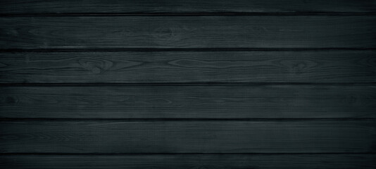 Black painted wooden board widescreen texture. Wood plank surface top view. Dark retro background