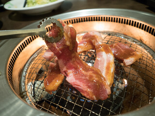 A delicious looking steak cooking on the grill