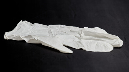 Medical glove on a black background